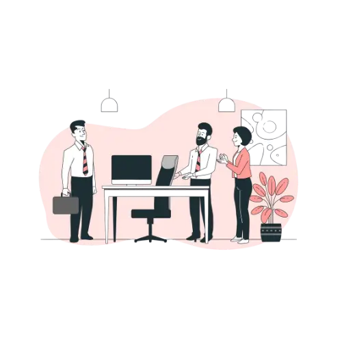 Trois personnes en costume dans un bureau, discutant près d'une table avec un ordinateur.